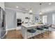 Kitchen with island, stainless steel appliances, white cabinetry, and breakfast bar at 1392 Founders Way, Mount Pleasant, SC 29464