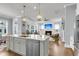 Spacious kitchen island with marble countertop, stainless steel dishwasher and pendant lighting at 1392 Founders Way, Mount Pleasant, SC 29464