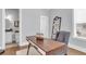 Home office with a modern desk, ladder shelf and half bathroom at 1392 Founders Way, Mount Pleasant, SC 29464