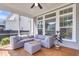 Comfortable screened patio with cushioned seating and a view of the backyard at 1392 Founders Way, Mount Pleasant, SC 29464