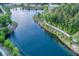 Scenic aerial view of a calm lake with lush green trees and a walking path at 1392 Founders Way, Mount Pleasant, SC 29464