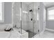 Modern bathroom shower with marble tile, glass enclosure, and stylish fixtures, perfect for a luxurious experience at 1392 Founders Way, Mount Pleasant, SC 29464