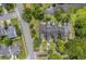 Overhead view of home with black roof in a residential neighborhood and pond at 15 A Par Dr # 27, Charleston, SC 29414