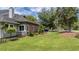 Expansive lawn, mature trees, and landscaping surrounding the property's exterior at 15 A Par Dr # 27, Charleston, SC 29414