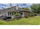View of the backyard, featuring a patio, fenced area, green lawn, and exterior at 15 A Par Dr # 27, Charleston, SC 29414