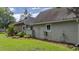 Well-maintained lawn, mature plants, and the home's exterior details at 15 A Par Dr # 27, Charleston, SC 29414