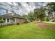 Home with a brick and siding exterior plus a green lawn with mature shade trees at 15 A Par Dr # 27, Charleston, SC 29414