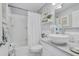 Clean bathroom featuring tub/shower combo, vessel sink, and coastal decor for a calming atmosphere at 15 A Par Dr # 27, Charleston, SC 29414