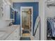 Well-appointed bathroom showcasing double vanity, walk-in shower, and blue walls at 15 A Par Dr # 27, Charleston, SC 29414
