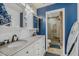 Bathroom featuring double sinks, updated vanity and blue accent wall at 15 A Par Dr # 27, Charleston, SC 29414