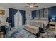 Stylish bedroom featuring blue accent wall, decorative windows, and plush bedding for ultimate comfort at 15 A Par Dr # 27, Charleston, SC 29414