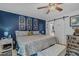 Inviting bedroom features king bed, sliding barn door to bathroom, and lake themed decor at 15 A Par Dr # 27, Charleston, SC 29414