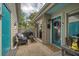 Inviting outdoor patio space with furniture, grill, and porch; complete with charming welcome decor at 15 A Par Dr # 27, Charleston, SC 29414