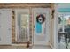 Enclosed sunroom with welcome decor on the entry door at 15 A Par Dr # 27, Charleston, SC 29414