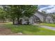Charming single-story home with manicured lawn, mature trees, and inviting curb appeal at 15 A Par Dr # 27, Charleston, SC 29414