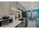 Cozy kitchen features modern appliances, grey cabinetry, and an eat-in dining area with water view at 15 A Par Dr # 27, Charleston, SC 29414