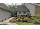 Charming home with a beautifully landscaped side yard, complete with flowers and decorative elements at 15 A Par Dr # 27, Charleston, SC 29414