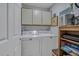 Functional laundry room with washer, dryer, and storage cabinets for convenience and organization at 15 A Par Dr # 27, Charleston, SC 29414