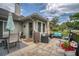 Spacious outdoor patio with comfortable seating, an umbrella, and lush landscaping, perfect for enjoying the outdoors at 15 A Par Dr # 27, Charleston, SC 29414