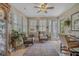 Bright sunroom with ample natural light, comfortable seating, and views of the outdoors, ideal for relaxing at 15 A Par Dr # 27, Charleston, SC 29414