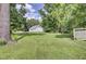 Lush backyard with mature trees, offering a serene, private outdoor space for relaxation and recreation in a quiet neighborhood at 154 Patrick Ln, Summerville, SC 29483