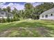 Spacious backyard featuring lush green grass, a fenced perimeter, and storage building providing ample room for outdoor activities at 154 Patrick Ln, Summerville, SC 29483