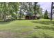Sprawling backyard with a well-maintained lawn and a storage shed in the distance at 154 Patrick Ln, Summerville, SC 29483