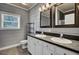 A spacious bathroom featuring a double sink vanity, decorative mirrors, and contemporary finishes at 154 Patrick Ln, Summerville, SC 29483