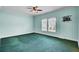 Spacious bedroom with a ceiling fan, carpet, two large windows providing ample natural light, and cable hookups at 154 Patrick Ln, Summerville, SC 29483