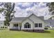 Charming single-Gathering home featuring manicured lawn and a welcoming front porch at 154 Patrick Ln, Summerville, SC 29483