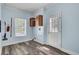 Laundry room with blue walls, modern flooring, and built in cabinets, as well as a utility sink hookup at 154 Patrick Ln, Summerville, SC 29483