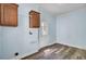 Laundry room with blue walls, modern flooring, and built in cabinets, as well as a utility sink hookup at 154 Patrick Ln, Summerville, SC 29483