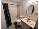 Bathroom featuring a bathtub, toilet, vanity, and decorative mirror with ornate details at 1640 Dogwood Rd, Charleston, SC 29414