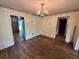 Classic dining room featuring hardwood floors, a vintage chandelier, and views into adjoining rooms at 1640 Dogwood Rd, Charleston, SC 29414