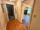 Hallway showcasing hardwood floors and doorways leading to other rooms of the house at 1640 Dogwood Rd, Charleston, SC 29414