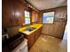 Kitchen view with wooden cabinetry, yellow countertops, and a window offering natural light at 1640 Dogwood Rd, Charleston, SC 29414