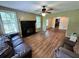 Inviting living room featuring hardwood floors, a fireplace, and windows providing natural light at 1640 Dogwood Rd, Charleston, SC 29414