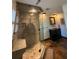 Bathroom with a glass-enclosed shower, rain shower head, built-in bench, and tiled walls at 1866 Capri Dr, Charleston, SC 29407