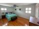 Charming bedroom with hardwood floors, natural light, ceiling fan and a cozy window seat at 1866 Capri Dr, Charleston, SC 29407