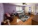 Cozy bedroom showcasing hardwood floors, ample closet space, and a ceiling fan at 1866 Capri Dr, Charleston, SC 29407
