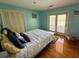 Comfortable bedroom featuring hardwood floors, closet and sliding glass doors to the outside at 1866 Capri Dr, Charleston, SC 29407
