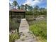 Private dock with a gazebo overlooking the serene marsh views, ideal for boating and enjoying nature at 1866 Capri Dr, Charleston, SC 29407