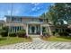 Charming two-story brick home with a welcoming front porch, manicured landscaping, and beautiful driveway at 1866 Capri Dr, Charleston, SC 29407