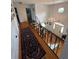 Bright foyer features hardwood floors, elegant staircase, chandelier, and natural light at 1866 Capri Dr, Charleston, SC 29407