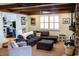 Comfortable living room with a brick fireplace, ample seating, and abundant natural light at 1866 Capri Dr, Charleston, SC 29407