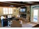 Comfortable living room with a brick fireplace, ample seating, and abundant natural light at 1866 Capri Dr, Charleston, SC 29407