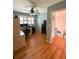 Well-lit office featuring hardwood floors, large windows, and a view of the staircase at 1866 Capri Dr, Charleston, SC 29407