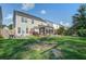 Spacious backyard with a fire pit, patio and lush greenery, perfect for outdoor entertaining and relaxation at 2017 Asher Loop, Summerville, SC 29485