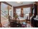 Dining room with wood table and chairs and bright natural light at 2017 Asher Loop, Summerville, SC 29485