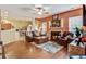 Inviting living room with fireplace, hardwood floors, and access to the kitchen at 2017 Asher Loop, Summerville, SC 29485